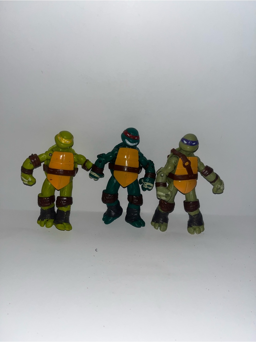 Three Turtle-Inspired Action Figures Set - Green, Dark Green, Light Green